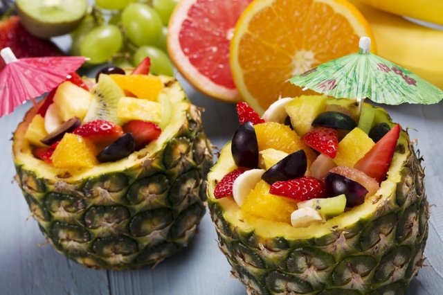 Fresh fruit salad served in bowls with fresh pineapple