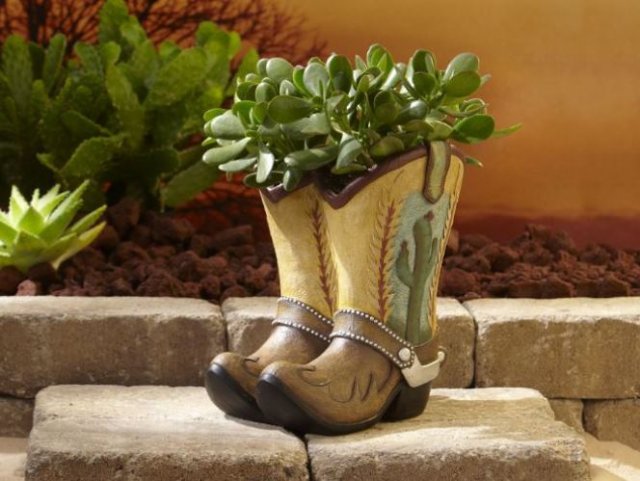 Planter made from old cowboy boots